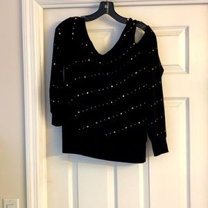 A one sided cold shoulder top.